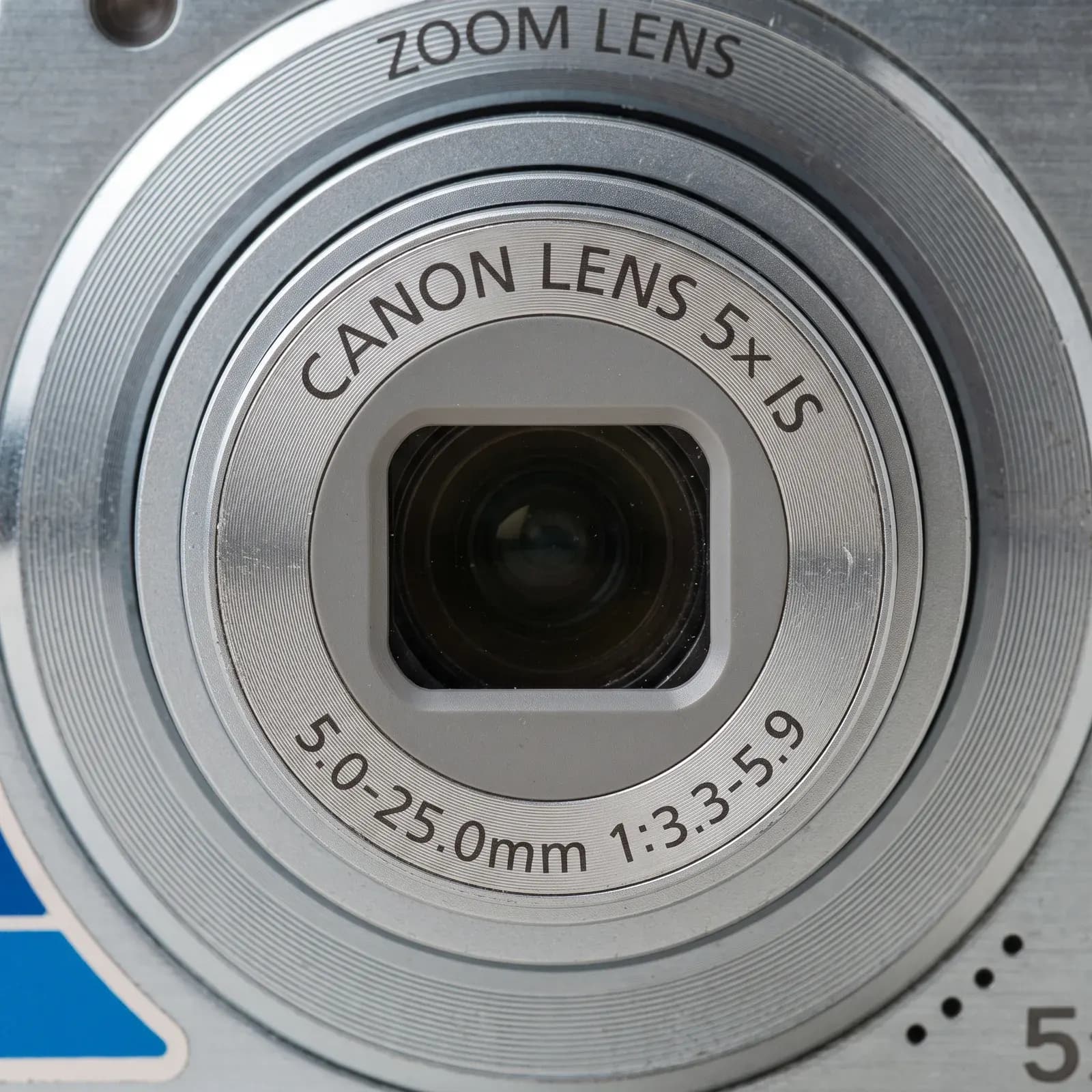 Detalle del aro del lente: Canon Lens 5x IS, 5,0-25,0 mm 1:3,3-5,9